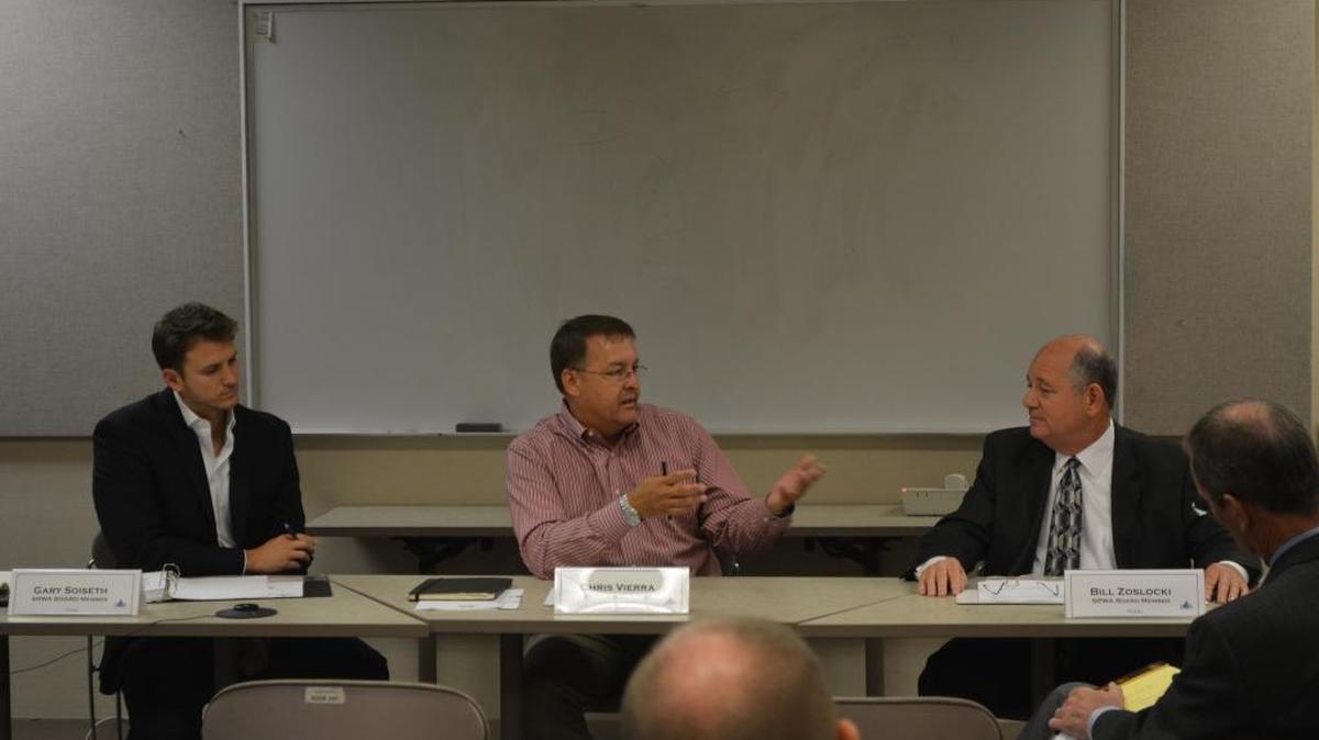 Turlock Mayor Gary Soiseth, left, Ceres Mayor Chris Vierra, center and Modesto City Councilman Bill Zoslocki engage in a debate over water at a meeting on Thursday.