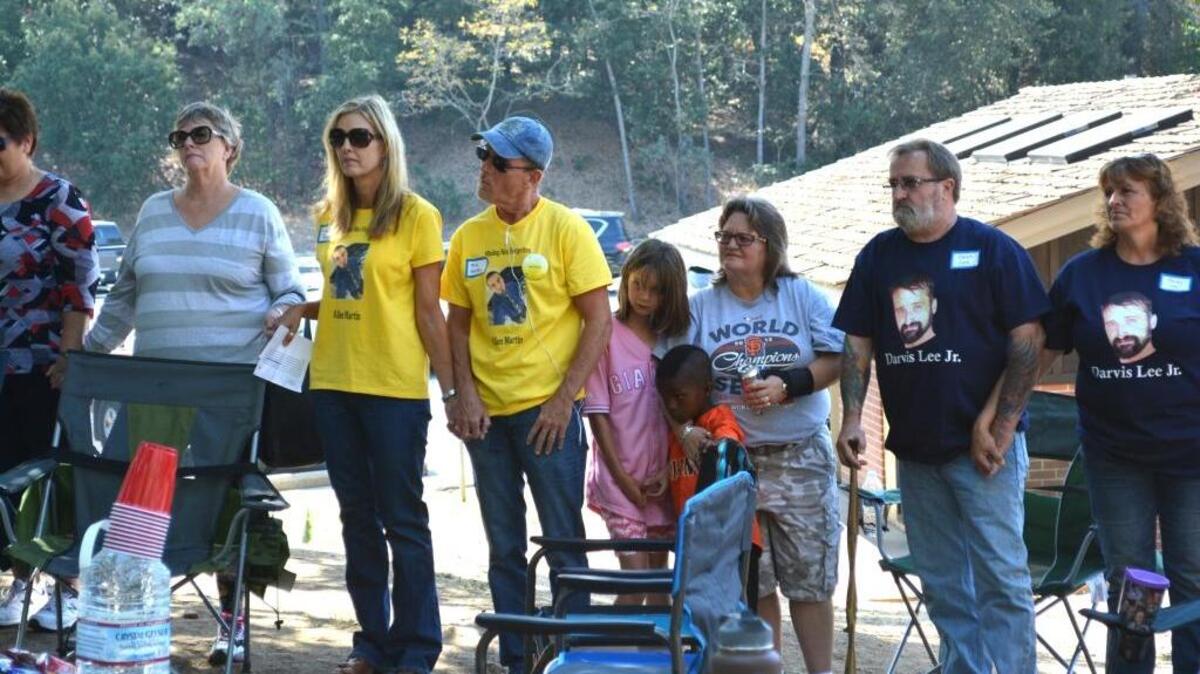 Linda and Mike Hatter, at center in yellow T-shirts, and Darvis and Sandy Lee, at right in blue shirts, attend the first Tuolumne County Missing Persons Awareness Day on Saturday, Sept. 10, 2016, at Columbia State Historic Park. Each couple has a son who is missing.