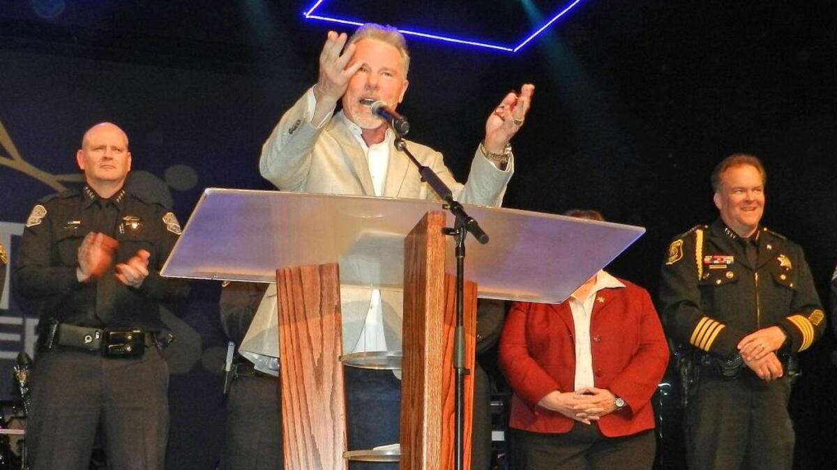 Senior Pastor Glen Berteau welcomes law enforcement to the stage during the Unity Matters celebration for first responders at The House Modesto Church in Modesto, California, on Monday, March 13, 2017.