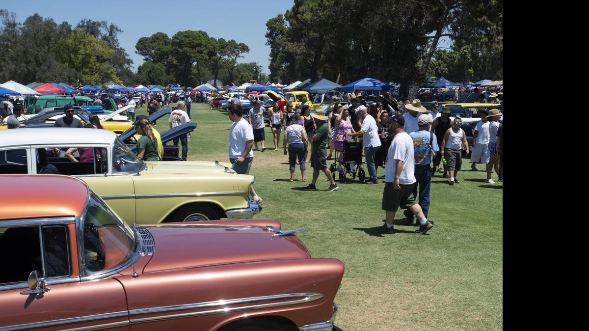 
Car enthusiasts walk around the many classic cars during the American Graffiti Festival and Car Show at Modesto Municipal Golf Course on Saturday.
