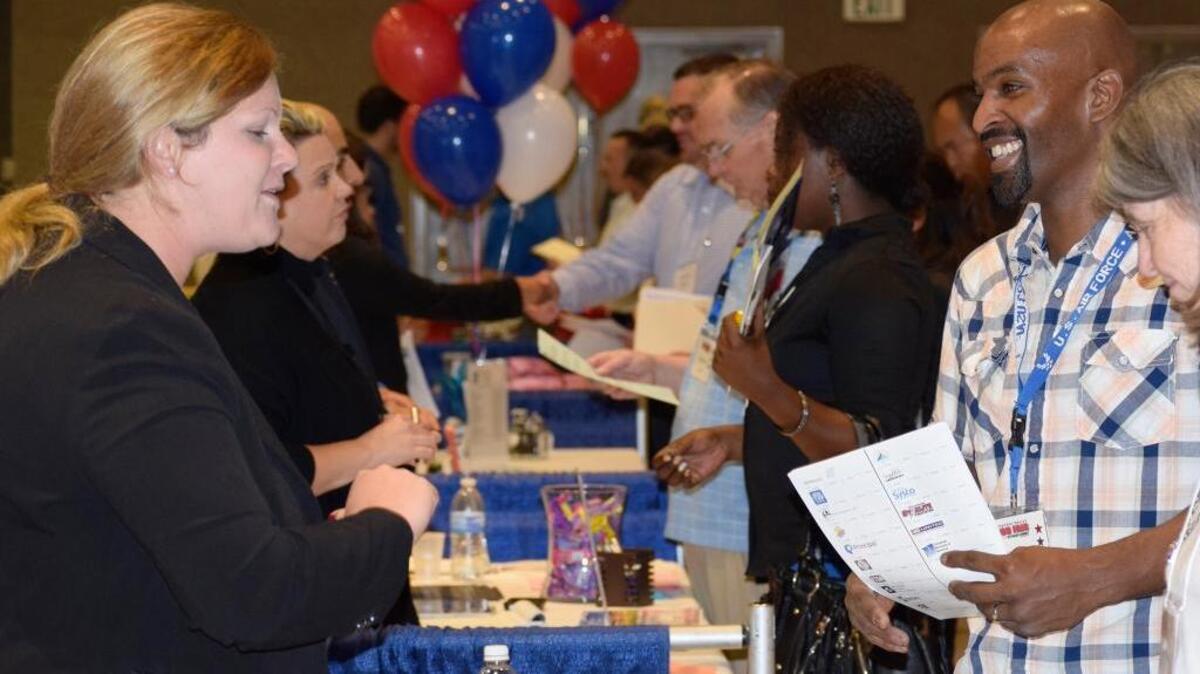 Air Force veteran Michael Williams visits the JP Morgan Chase table at the Central Valley Job Fair and Veterans Summit at Modesto Centre Plaza on Wednesday, April 6, 2016.