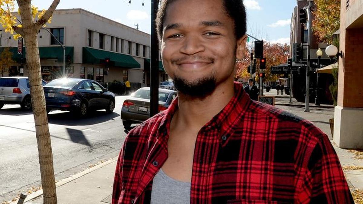 Terence Flagg, 19, of Ceres, beamed with positive energy while talking about the life changing opportunities he's had in Aspiranet's Independent Living Skills Program. Here he stands for a portrait outside the Aspiranet location on J Street in downtown Modesto, on November 27, 2017.