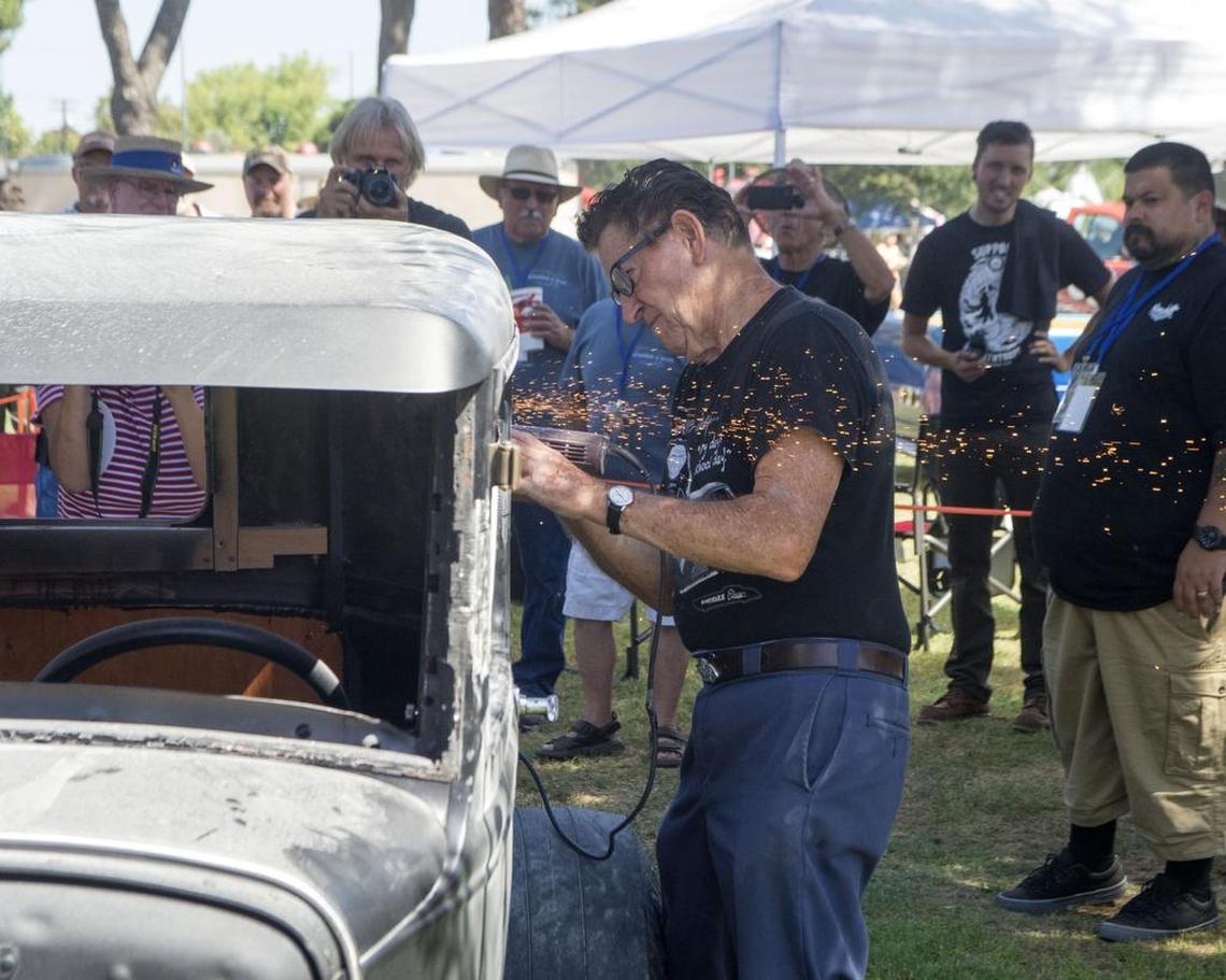 Modesto car chopper legend Gene Winfield cuts a top off a hot rod during a Graffiti Summer event in Modesto, California, in June 2015.