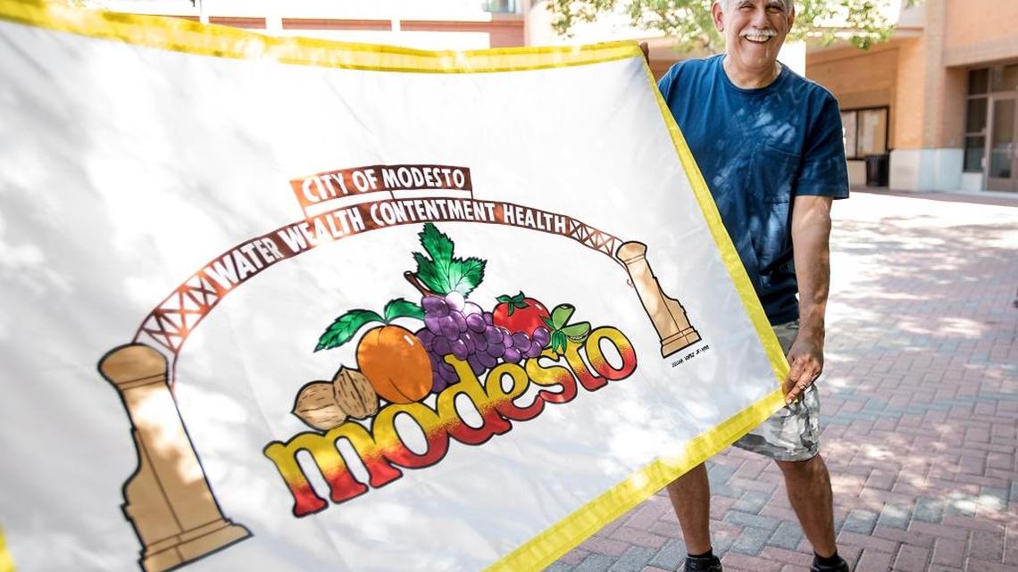 Julian Lopez Jr. holds the Modesto flag on Thursday, Aug. 25, 2016, that he says was selected as the official flag of the city of Modesto in 1988.