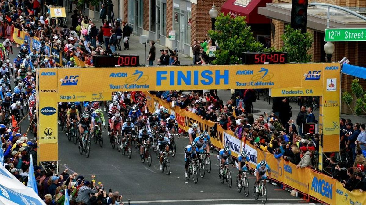 Cyclists make a pass across the finish line on their way to circling through Modesto during the Amgen Tour of California cycling race in 2011.