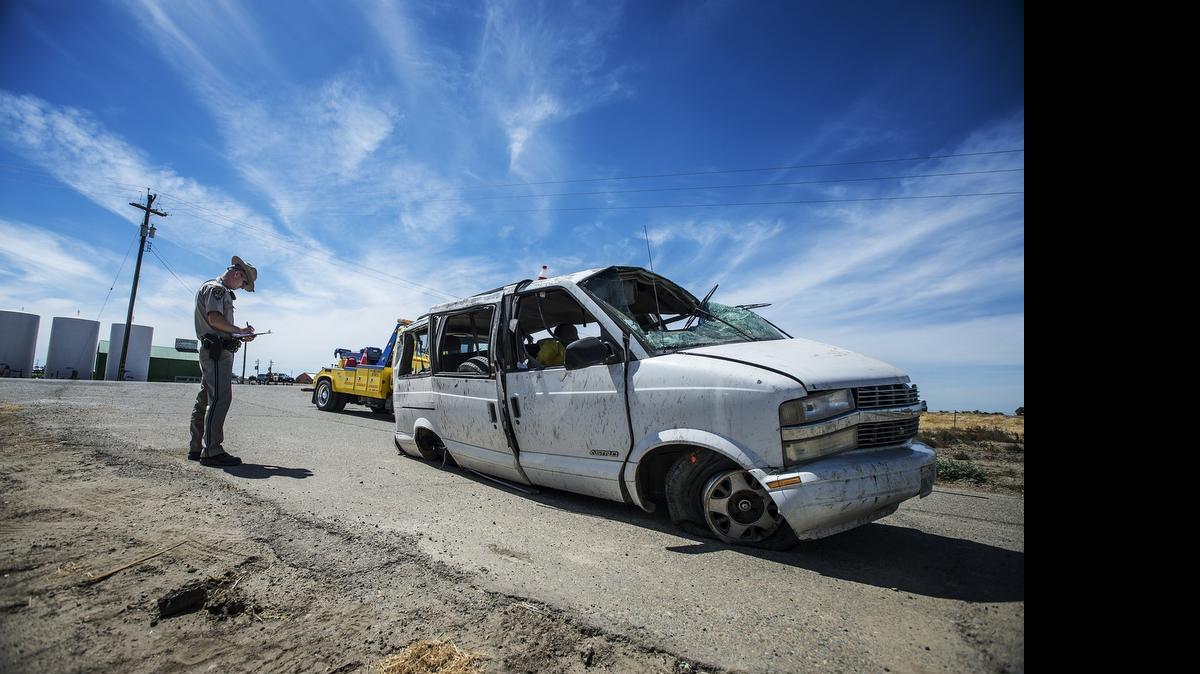 
The California Highway Patrol investigate the scene of a single vehicle crash that killed three people and sent five others to area hospitals near the intersection of Highway 152 and Island Road in Merced County, Calif., Saturday. According to Sgt. Jesse Lopez, the vehicle was driving east on Highway 152 before overturning. The cause of the crash remains under investigation.
