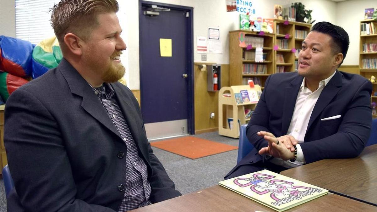 The anti-bullying book “Gladys Glasses” was written by Manteca resident Harry Pache, right, and illustrated by Phil Villanueva (not pictured). Pictured at left is Modesto Christian principal Matt Diehl.