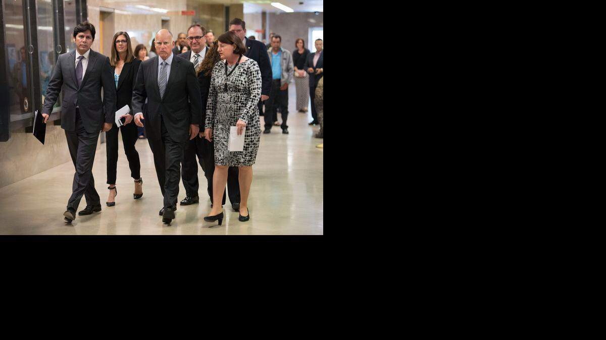
Gov. Jerry Brown, third from left, is joined by, from left, Senate President Pro Tem Kevin de León, Assembly Republican Leader Kristin Olsen, Senate Republican Leader Bob Huff and Assembly Speaker Toni Atkins, as they head to a Capitol news conference where they announced a $1.1 billion emergency drought package on Thursday.
