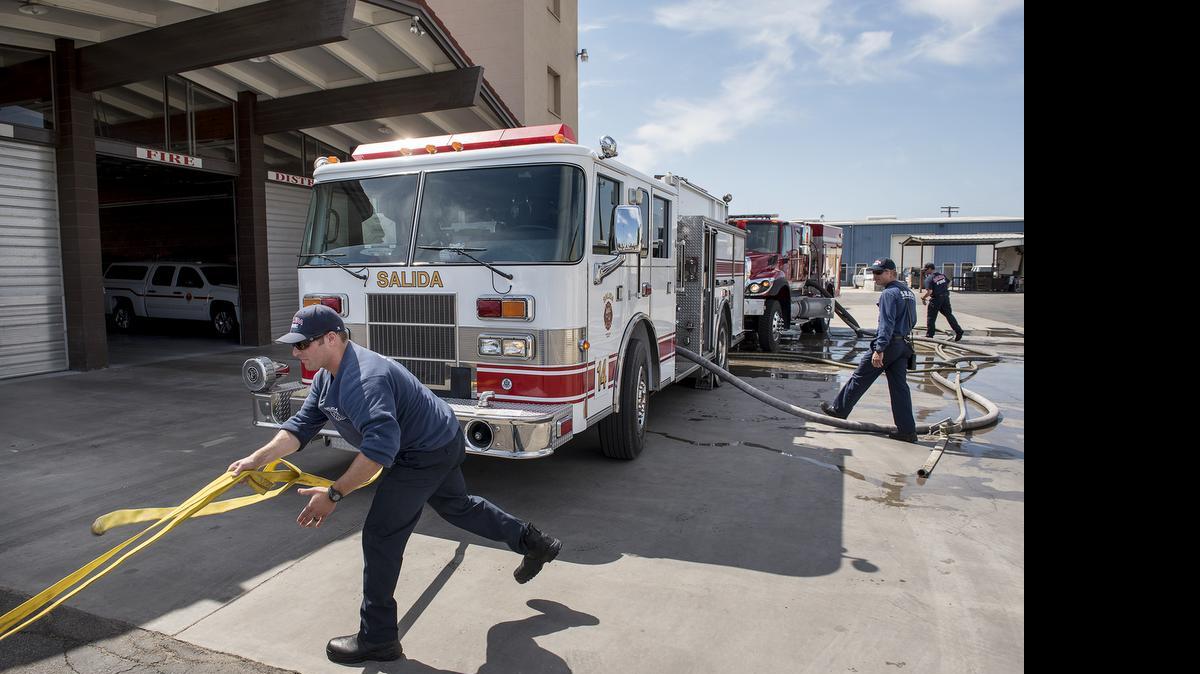 
Salida firefighter Vincent Diliberto rolls out hose during engineer training in Salida on Monday. Diliberto, a volunteer, is training to become an engineer at the department.
