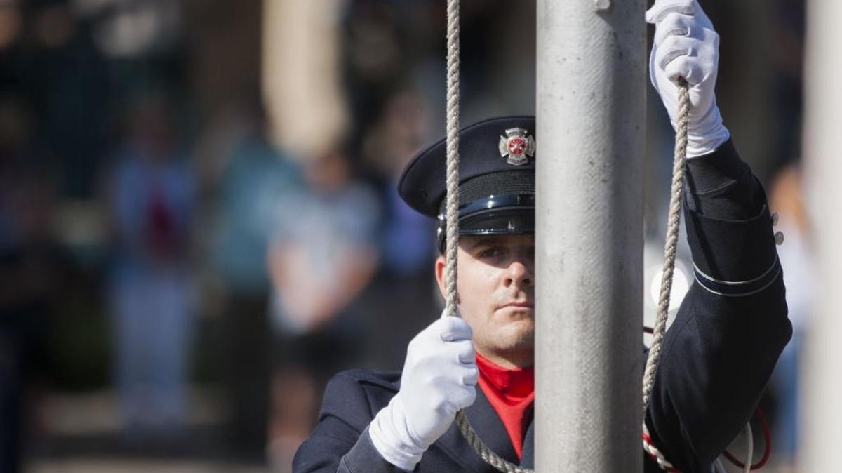 Modesto firefighter Jesse Miguel raises the flag during the Sept. 11 Remembrance ceremony Sunday, Sept. 11, 2016, at Fire Station 1.