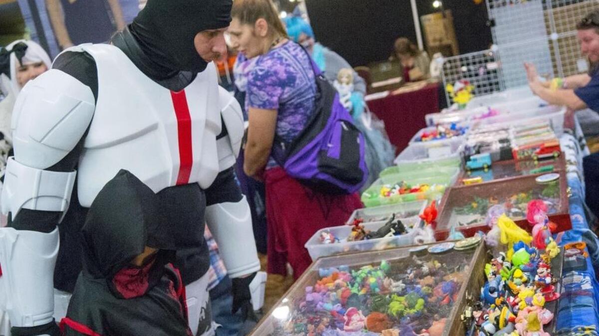 John Navarro (left, Republic Commander) looks at different specialty items during the 2016 Classic Comic Con in Modesto.