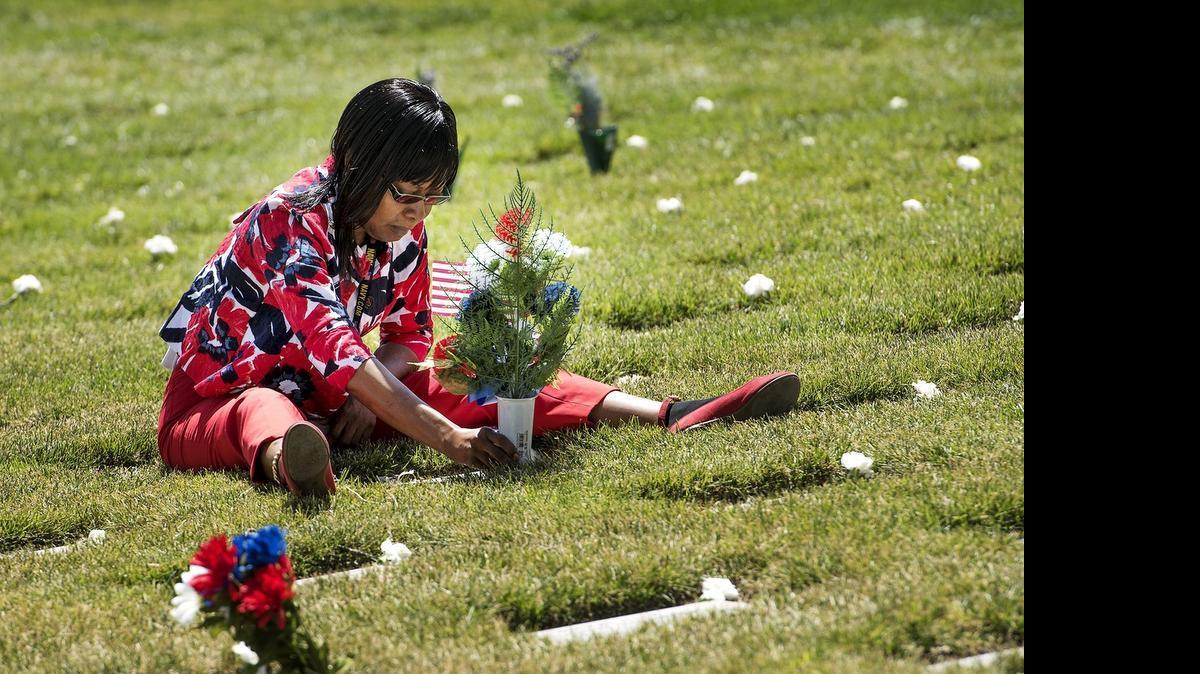 
Gwendolyn Stewart of Chowchilla sits at the gravesite of her late husband, Stephen Michael Stewart, a veteran of the Persian Gulf conflict, at San Joaquin Valley National Cemetery in Santa Nella on Sunday.
