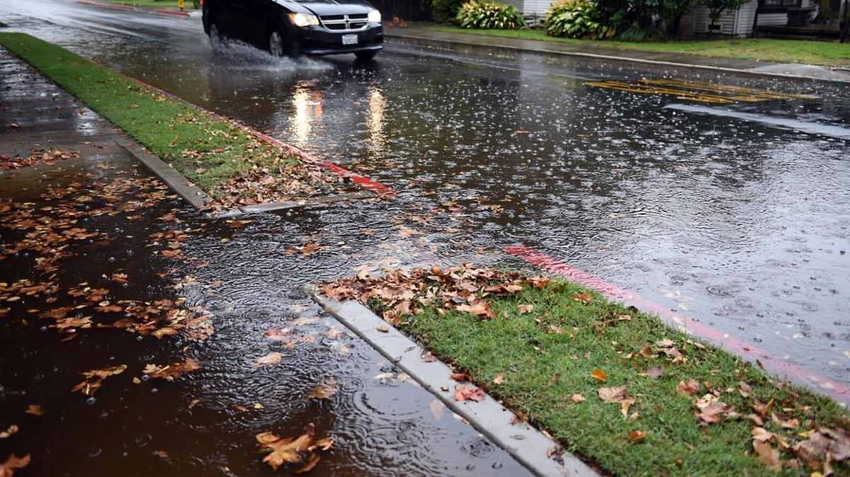 Streets are flooded on W Morris Avenue between Hackberry and Enslen Avenues in Modesto, Calif. Monday morning (11-02-15). With the rainy weather there have been non-injury fender bender accidents and also flooded streets.