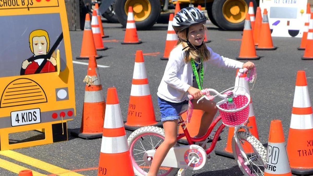 Violet Ray, 6, rides her bike through the training course during the Family Cycling Festival in downtown Modesto on Saturday, May 21, 2016.