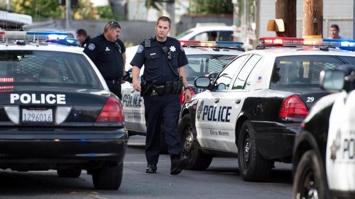 Modesto police investigate on Emerald Avenue after two groups of young men exchanged gunfire in on Wednesday, June 8, 2016.
