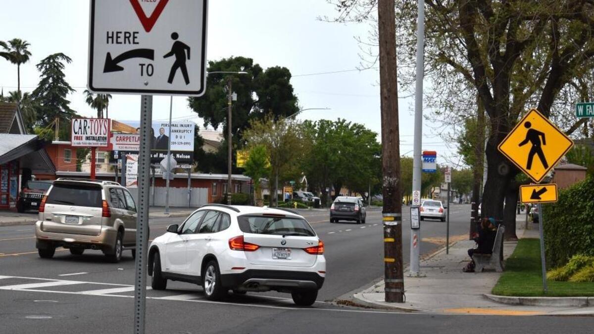 This McHenry Avenue crosswalk at Fairmont Avenue is marked by the two signs shown and one a bit farther north on McHenry alerting drivers that it lies ahead.