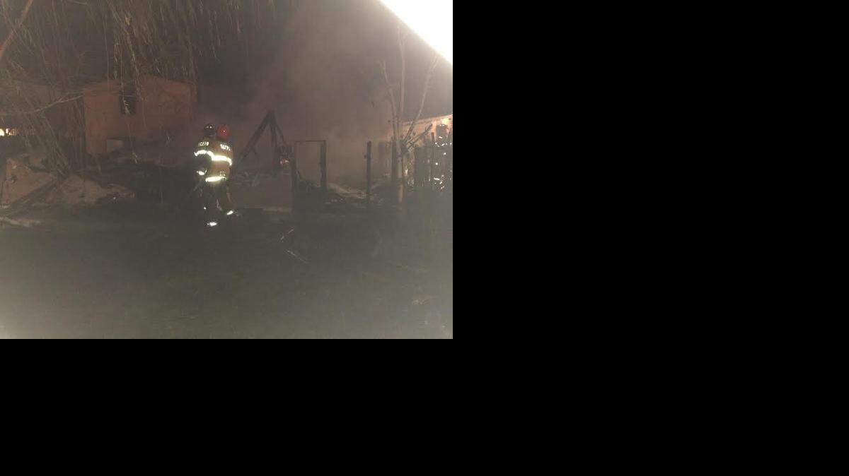 
Firefighters battle a blaze on Empire Avenue in Modesto on Sunday.
