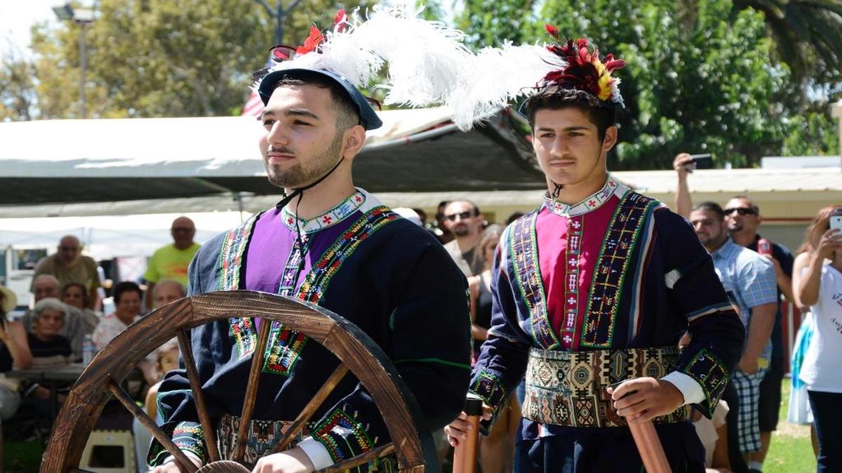 
The first-ever Assyrian Festival brought together parishes of the Assyrian Church of the East Diocese of California from the Central Valley and Bay Area. The two-day event at the Stanislaus County Fairgrounds in Turlock features food, cultural exhibits, dancing, arts and crafts and more. Modesto resident John Morad displays a wheel during a processional parade celebrating Assyrian inventions. 
