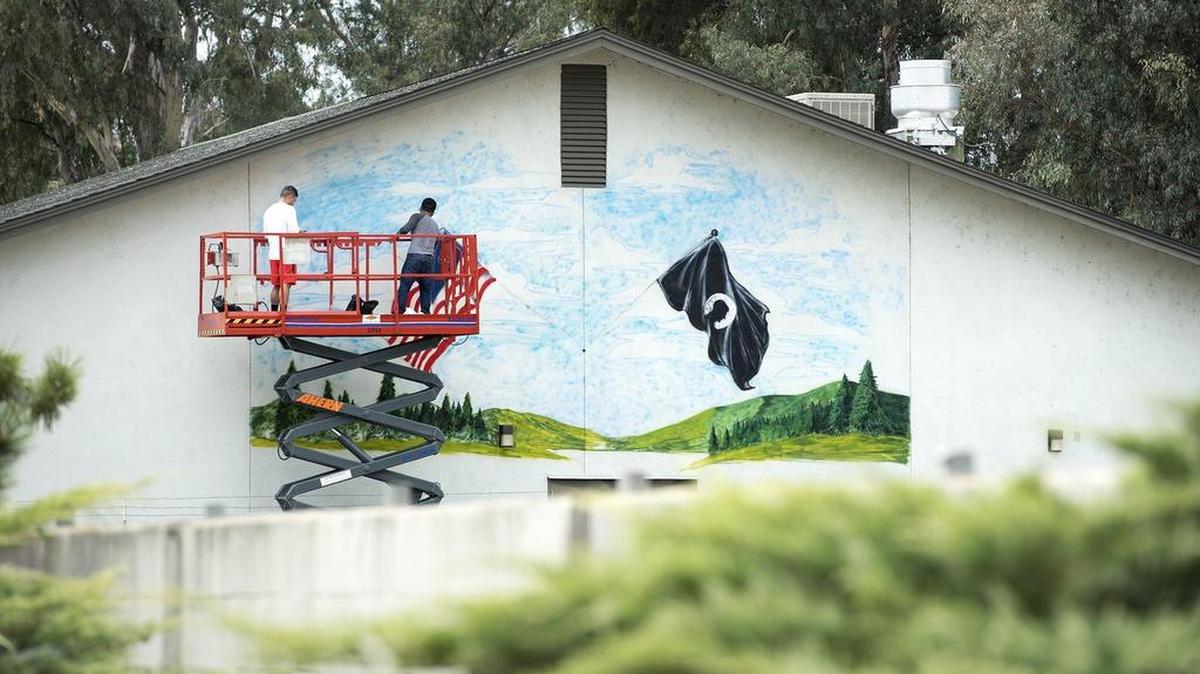 
Artist Miguel Herrera Dominguez works on a new mural at the VFW Post 3199 in Modesto on Tuesday, August, 4, 2015. Seen from Hatch Road.
