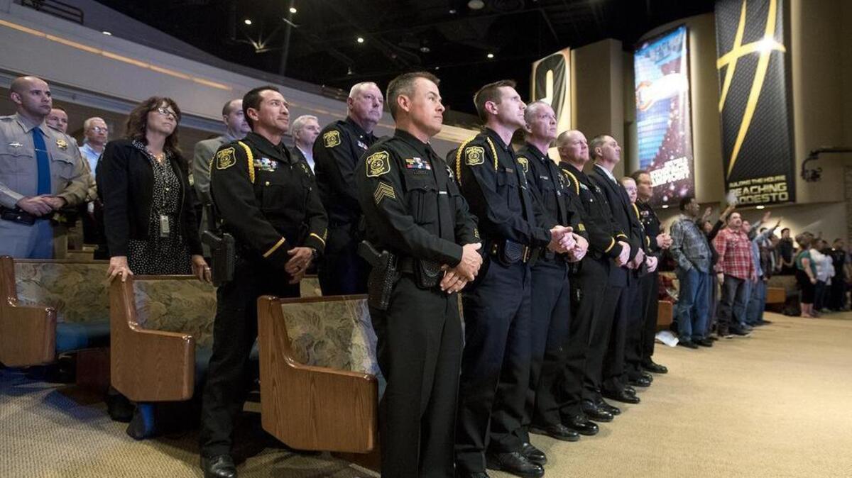 Local law enforcement personnel listen to a musical performance during Unity Matters, an event to honor area law enforcement, at The House Church in Modesto on Tuesday, March 1, 2016.