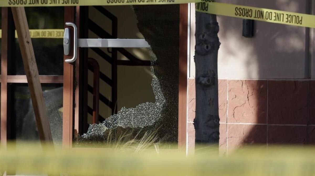 Yellow police tape is strung in front of Inland Regional Center, site of the Dec. 2 mass shooting in San Bernardino.