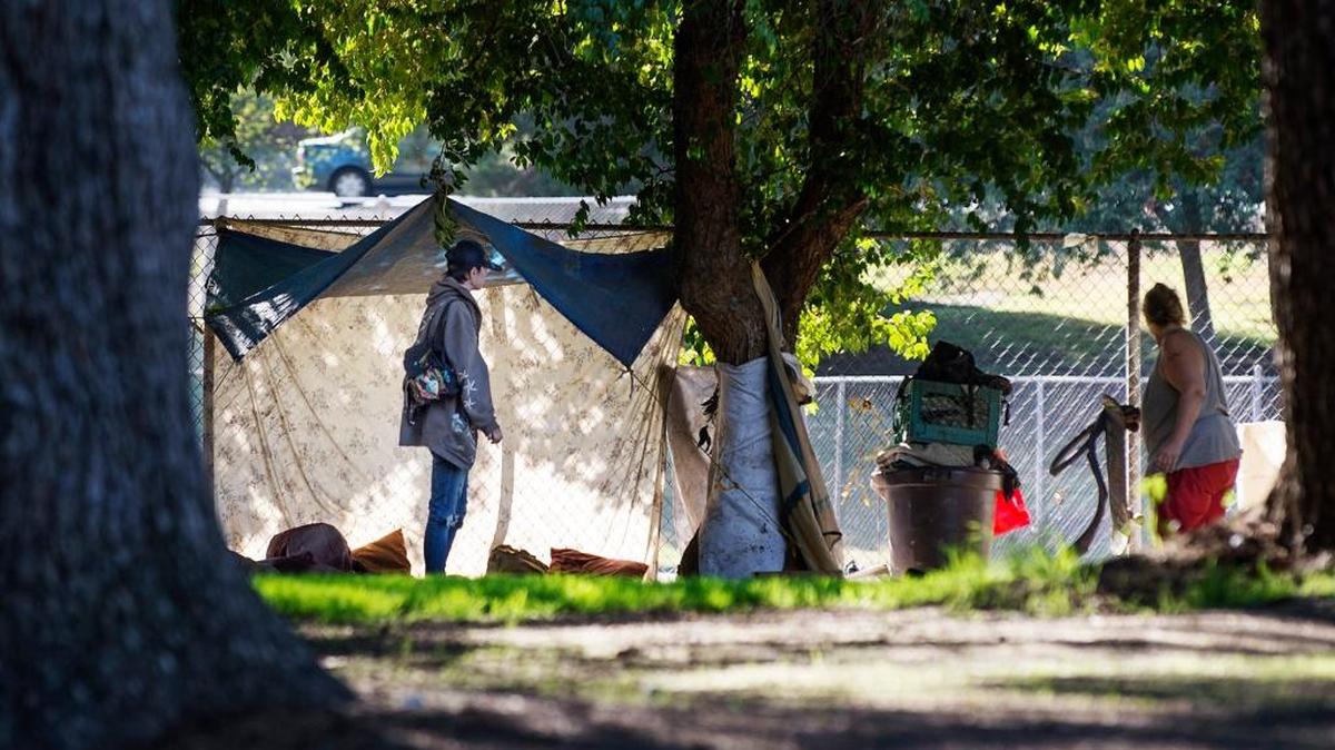 Homeless people camp out in Beard Brook Park in Modesto in 2014.