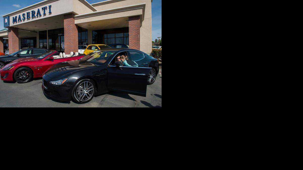 
Erika Baker, left, of Cameron Park and her daughter Bethany, 10, check out the space inside a 2014 four-door Maserati on Monday at the Niello Co.’s Maserati of Sacramento dealership.
