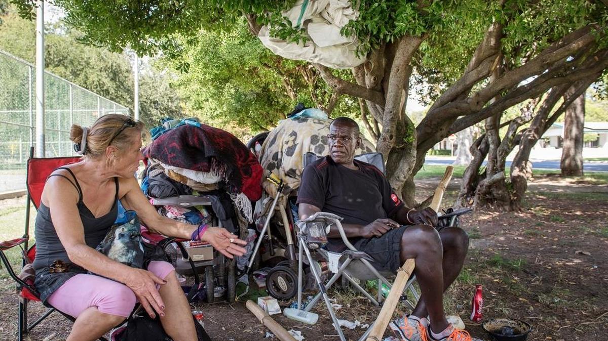 
Gerald Saunders and his girlfriend, Marlene, sit at Graceada Park in Modesto on Thursday, Sept. 24, 2015.
