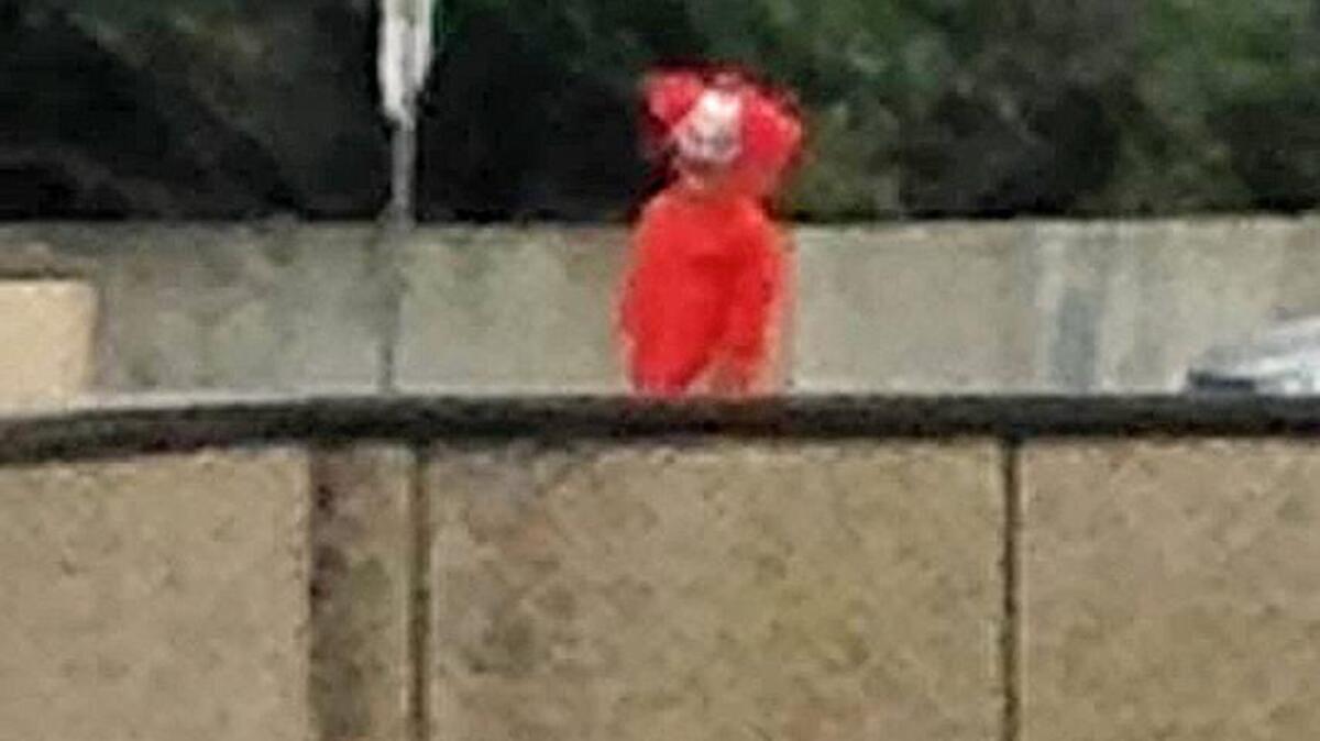 A person dressed as a creepy clown is spotted in the parking lot of Vintage Faire Mall on Monday, Oct. 3, 2016, in Modesto, Calif.