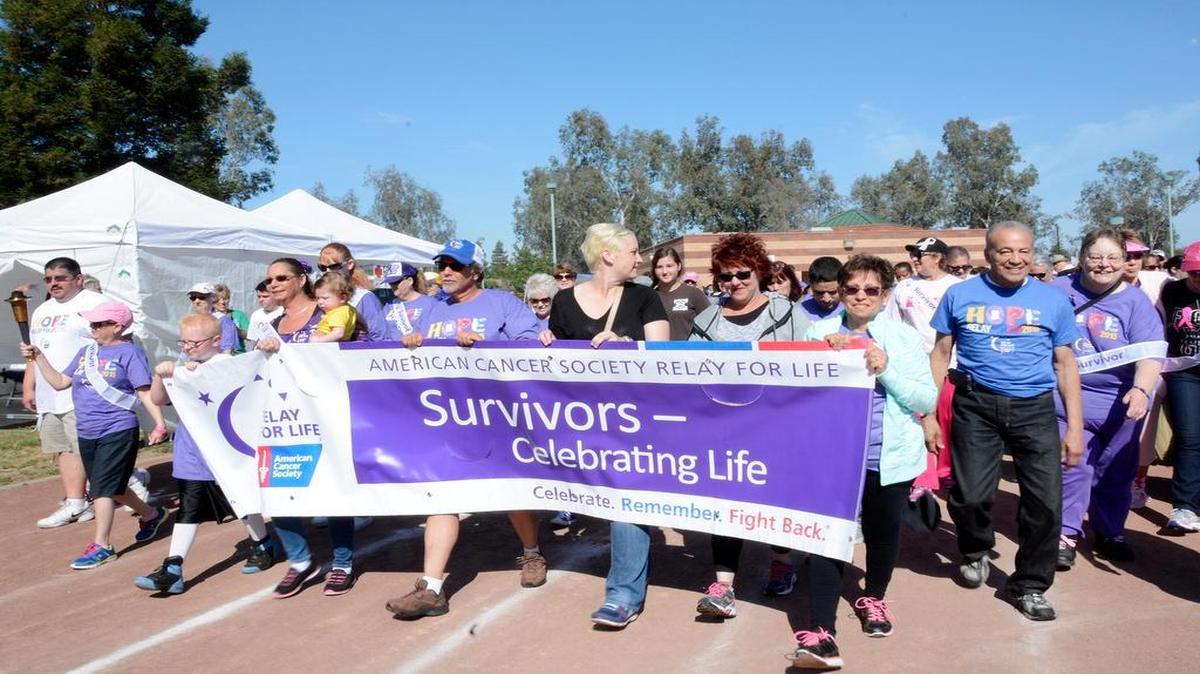 
 Close to 900 people took part in the 24-hour Relay for Life at Johansen High School. The race starts with the Survivors Lap.
