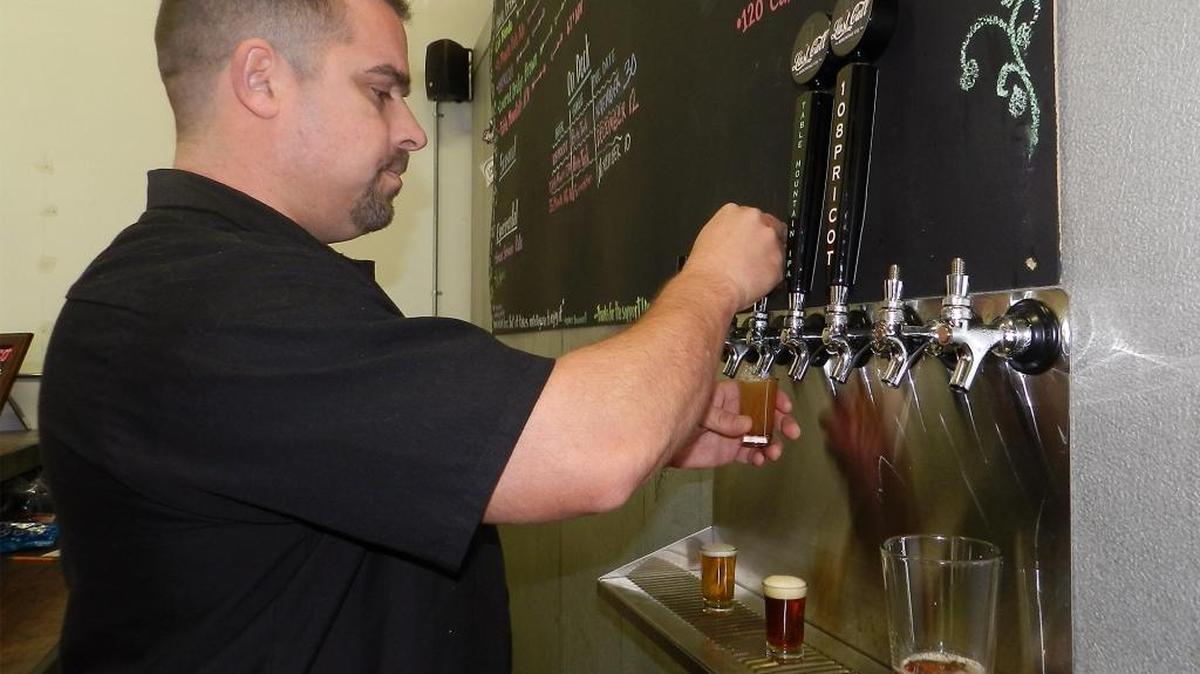 Brian Chiara, co-founder of Last Call Brewing Co. in Oakdale, pours samples in the taproom on Thursday, Jan. 7, 2016.