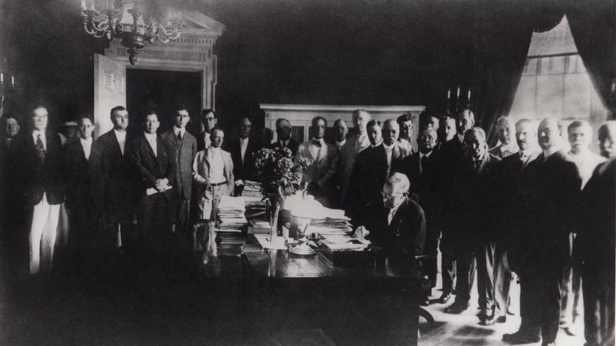 President Woodrow Wilson signs the bill that created the federal Farm Credit System in Washington, D.C., on July 17, 1916. The systems remains an important source of loans for farmers in and near Stanislaus County.