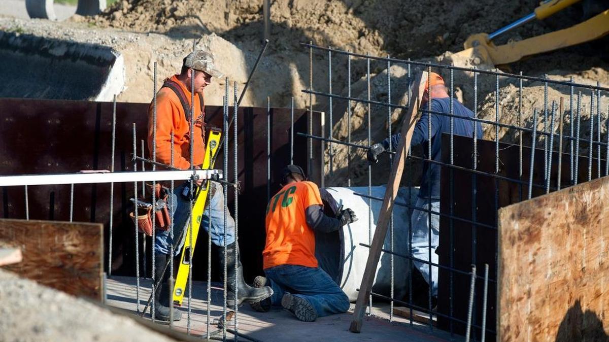 Workers construct a canal drop on Turlock Irrigation District’s lateral 8 canal in Hilmar on Tuesday, January, 6, 2015.