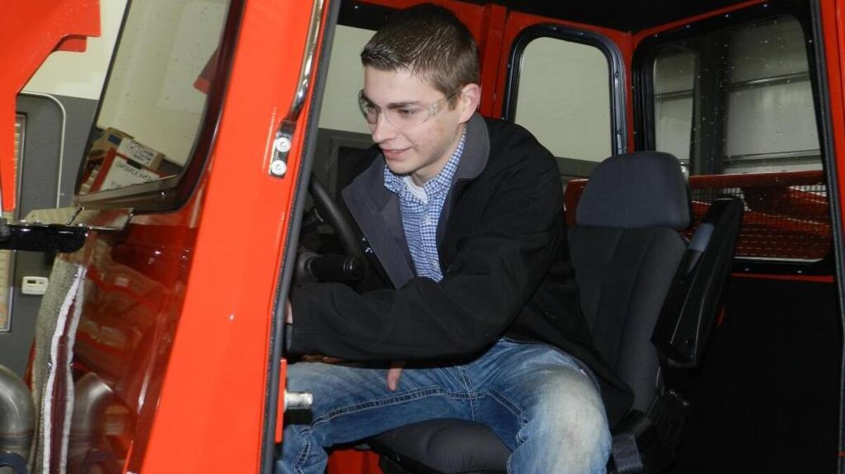 Andrew Skidmore, state president for Future Farmers of America, examines a nut harvesting machine at Flory Industries in Salida, Calif., on Thursday, Feb. 2, 2017. He was one of several agriculture students taking part in a job-shadowing day in Salida and a few other locations.