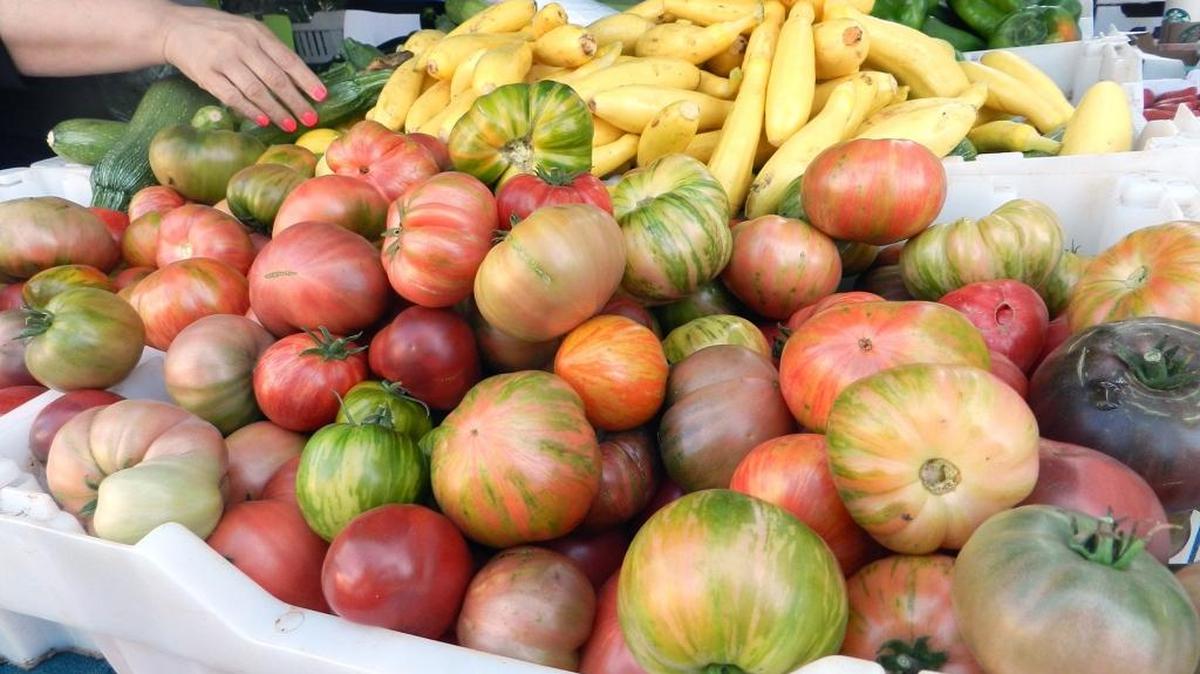 The previous Farm Bill included help for low-income people in buying healthy food, such as these heirloom tomatoes at the Modesto Certified Farmers Market in August 2016.