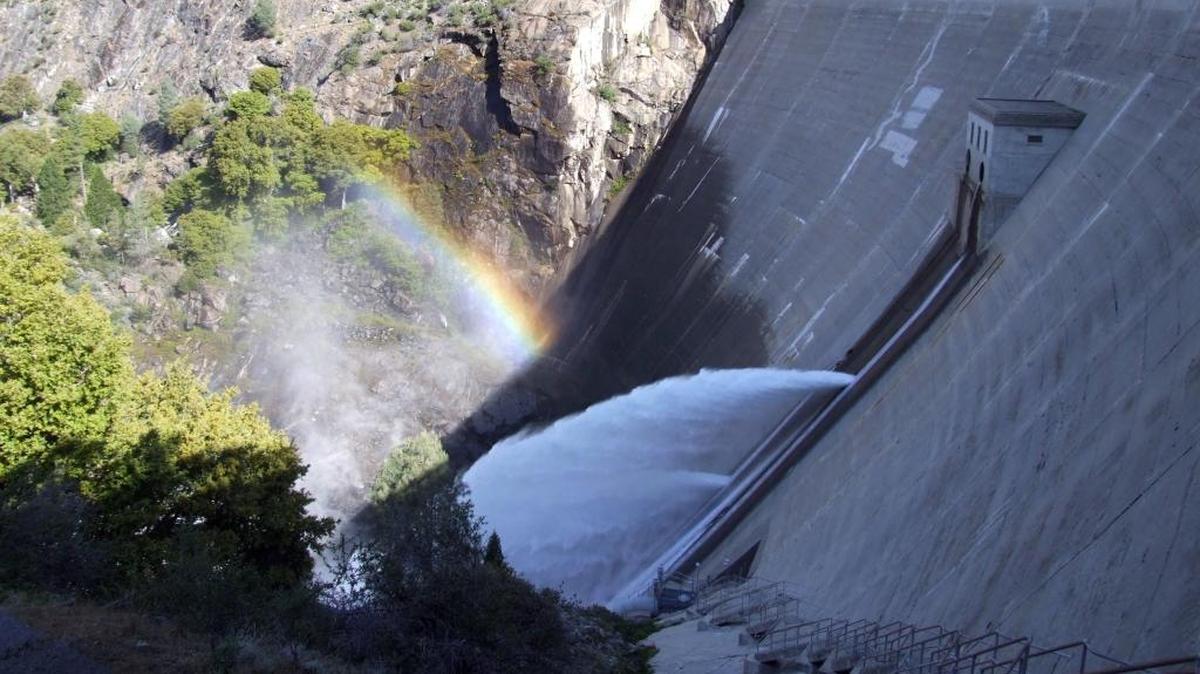 A rainbow forms in the mist from water releases at Hetch Hetchy Reservoir on the Tuolumne River in 2012. San Francisco Public Utilities Commission, which runs that city’s water system and provides wholesale supplies for parts of San Mateo, Santa Clara and Alameda counties, gets about 85 percent of its water from the Tuolumne.