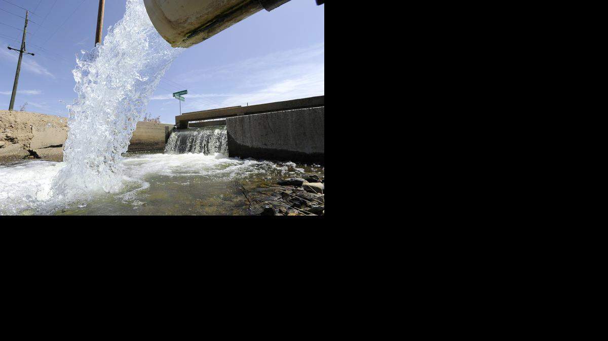 
Irrigation water pours into the Pilger lateral canal at Dickenson and El Capitan School Road in rural Merced in May. At Friday’s California Food & Ag Summit, speakers said competing demands for water could mean trouble. 
