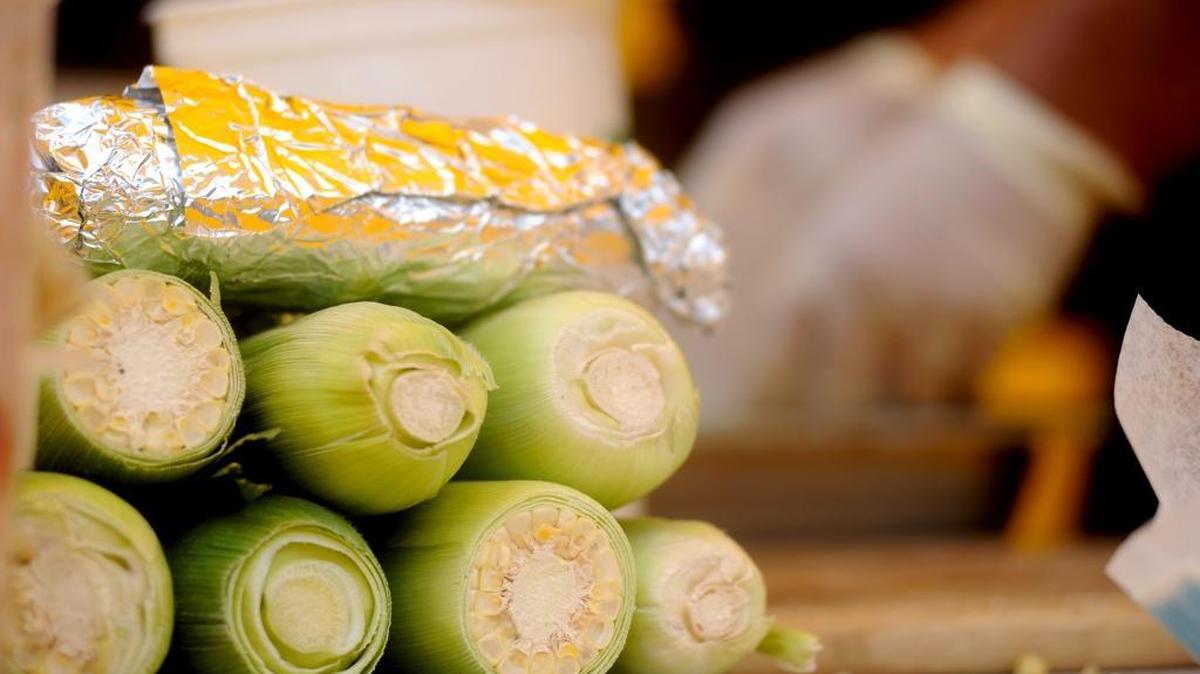 Fresh sweet corn awaits shoppers at a booth at the Vintage Faire Mall outdoor farmers market in August 2013. An updated “Local Food & Farm Guide” for the Stanislaus Grown campaign is available in print and online.