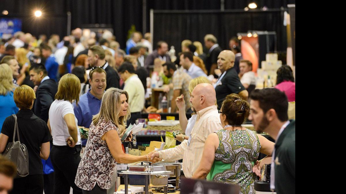 
The isles are crowded with potential buyers and local food representatives at the Fresno Food Expo at the Fresno Convention Center Thursday, July 24, 2014.
