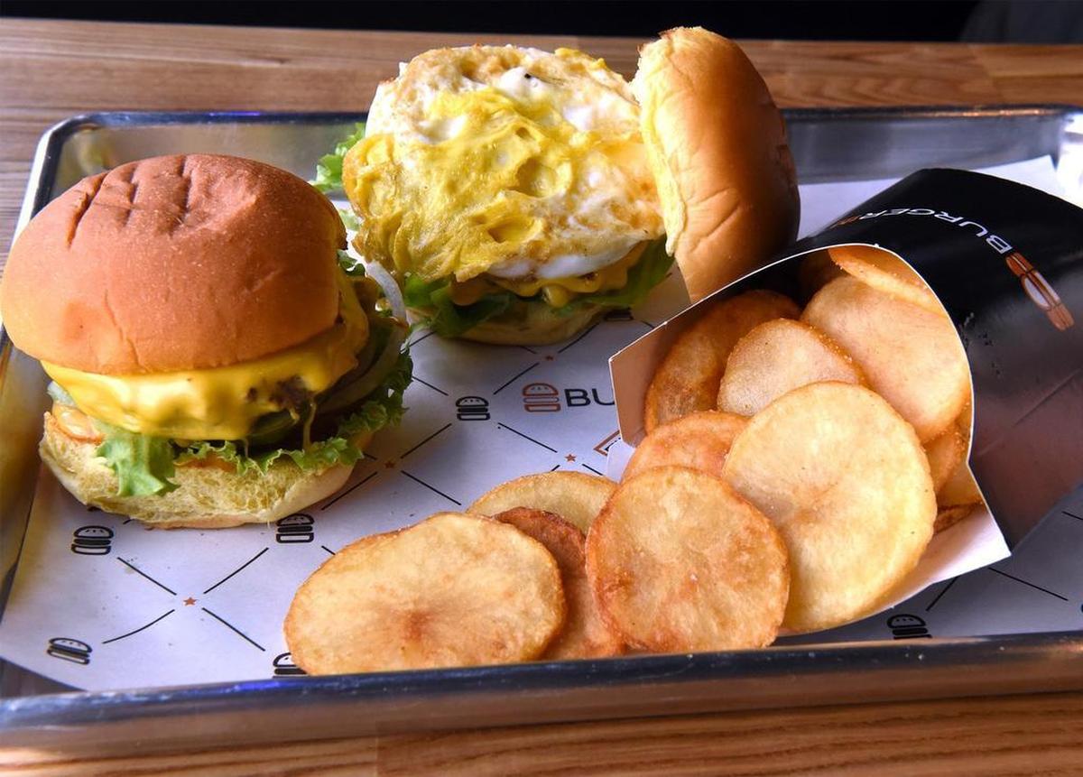 Burgers and fries at BurgerIM on Carpenter road in Modesto, Calif. are pictured on Friday March 29, 2019. The burger franchise specializes in gourmet burgers with a wide range of toppings.