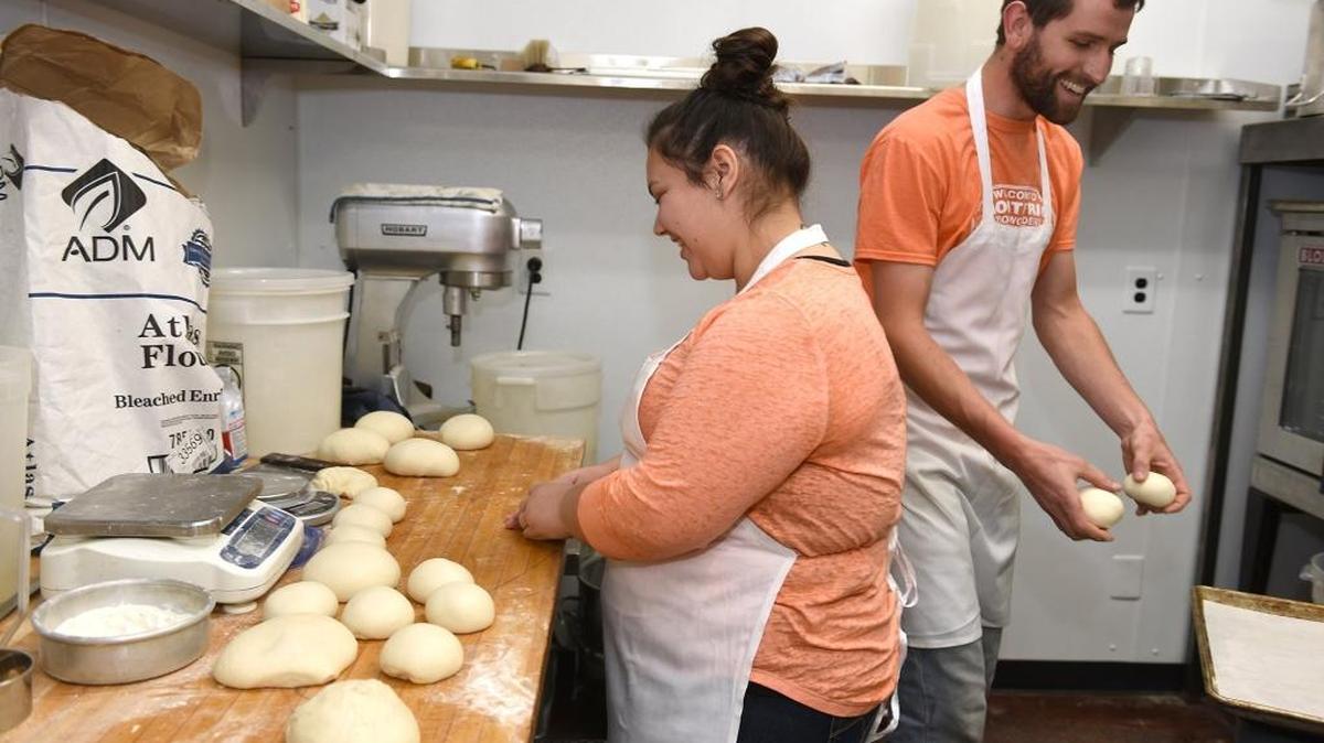Bakers Tyler Ebright and Megan Kinsfater form dough Thursday, April 28, 2016, at Crust & Crumb in Turlock. An offshoot of Edith’s Bakery, the restaurant offers baked goods, gourmet pizza and sandwiches.