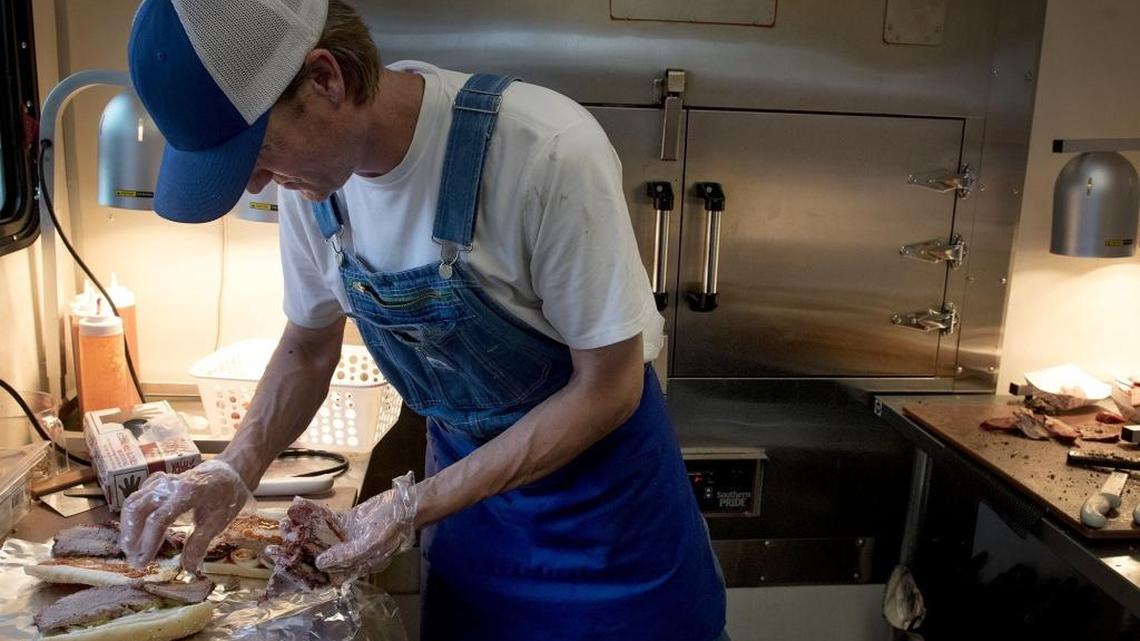 Owner Rob Geisler prepares sandwiches at Fasty’s BBQ Joint in Oakdale, Calif., on Thursday, April, 7, 2016.