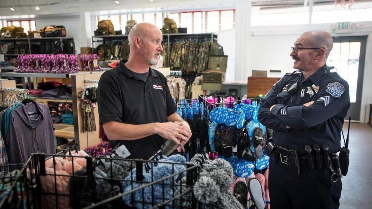 Owner Craig Stott talks with Modesto Police SGT. Lance Nicolai at Crescent Supply in Modesto, Calif., Wednesday, Nov. 14, 2018.