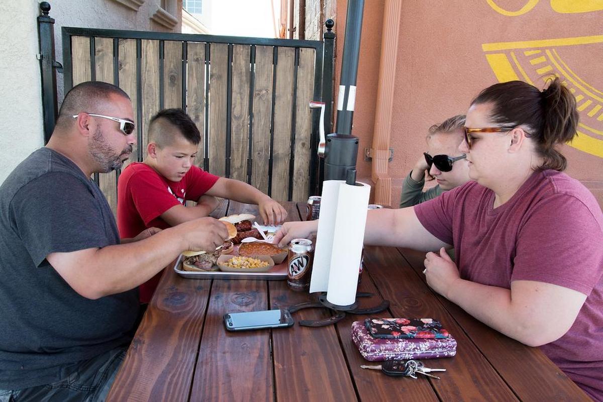 The Henard family of Hughson enjoys dinner at Slick Fork BBQ in Hughson Friday, Sept. 21, 2018. Pictured left to right: Donny, Cameron, Kilee and Brandi Henard.