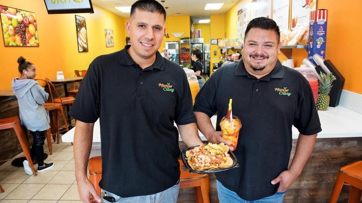 Owners Andy Lopez, left, and Larry Rivera, right, are expanding their at Mango Crazy business to a location at San Francisco’s Fisherman’s Wharf this fall. The two childhood friends started their first store four years ago at the Village One Plaza in Modesto, Calif. Photographed Thursday, August 23, 2018.