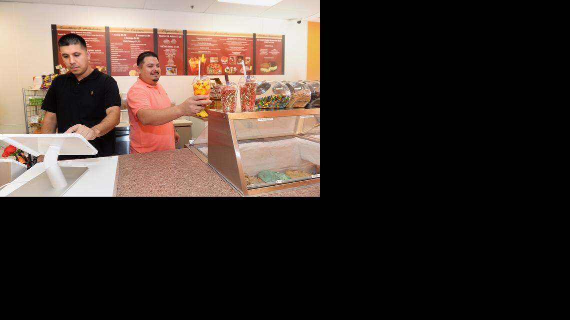 
Andy Lopez and Larry Rivera, co-owners of Mango Crazy, offer some unique treats, such as the mangonada, a mixture of fresh mango, mango sorbet, lime juice, chamoy, hot sauce, salt, chili powder and a tamarind candy-wrapped straw.
