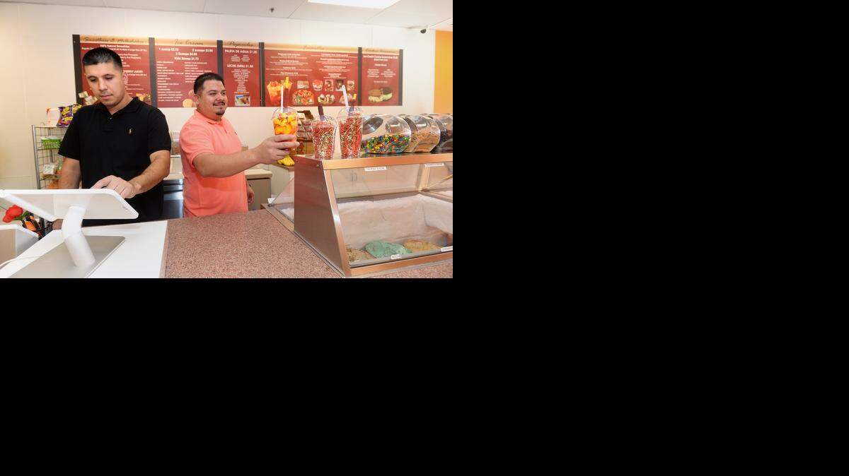 
Andy Lopez and Larry Rivera, co-owners of Mango Crazy, offer some unique treats, such as the mangonada, a mixture of fresh mango, mango sorbet, lime juice, chamoy, hot sauce, salt, chili powder and a tamarind candy-wrapped straw.
