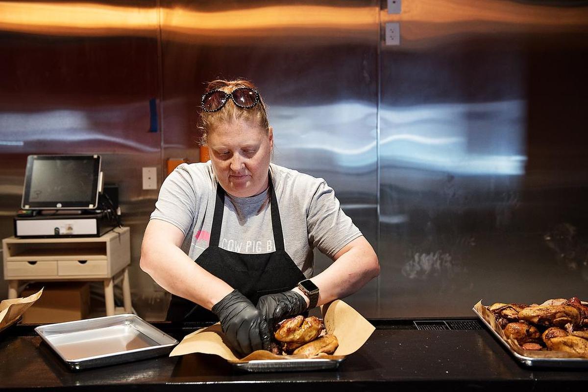 Owner and chef Heather Love prepares a large sampler of the BBQ meat at The Burnt End restaurant in Modesto, Calif., on Thursday, Sept. 13, 2018.