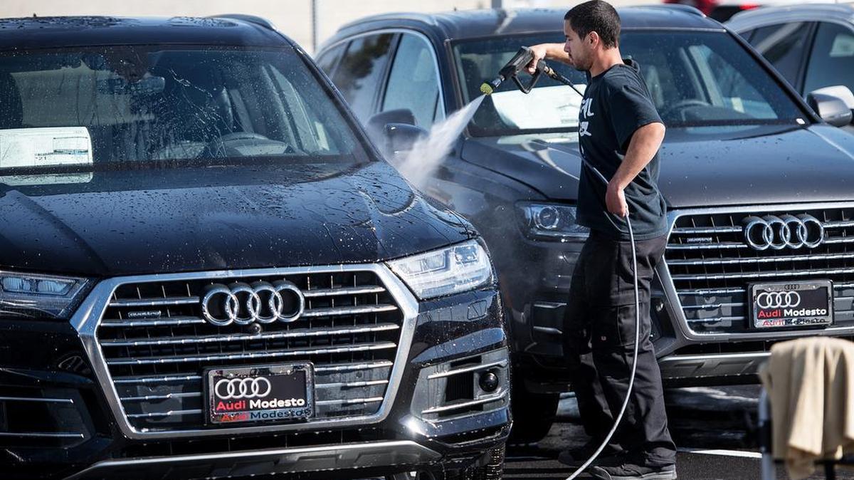Andrew Franklin washes cars at the new Audi dealership on McHenry Avenue in Modesto, Calif., on Wednesday, Oct. 31, 2018.