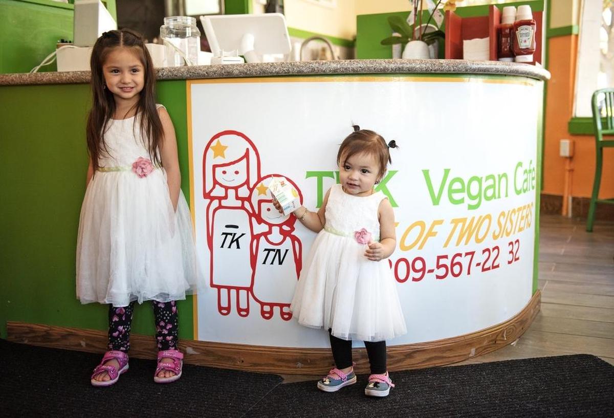 Two sisters, Faye, 3, left, and Zireael, 1, who inspired the name of the THK Vegan Cafe: Tale of Two Sisters on Needham Street in Modesto, Calif., Wednesday, July11, 2018.